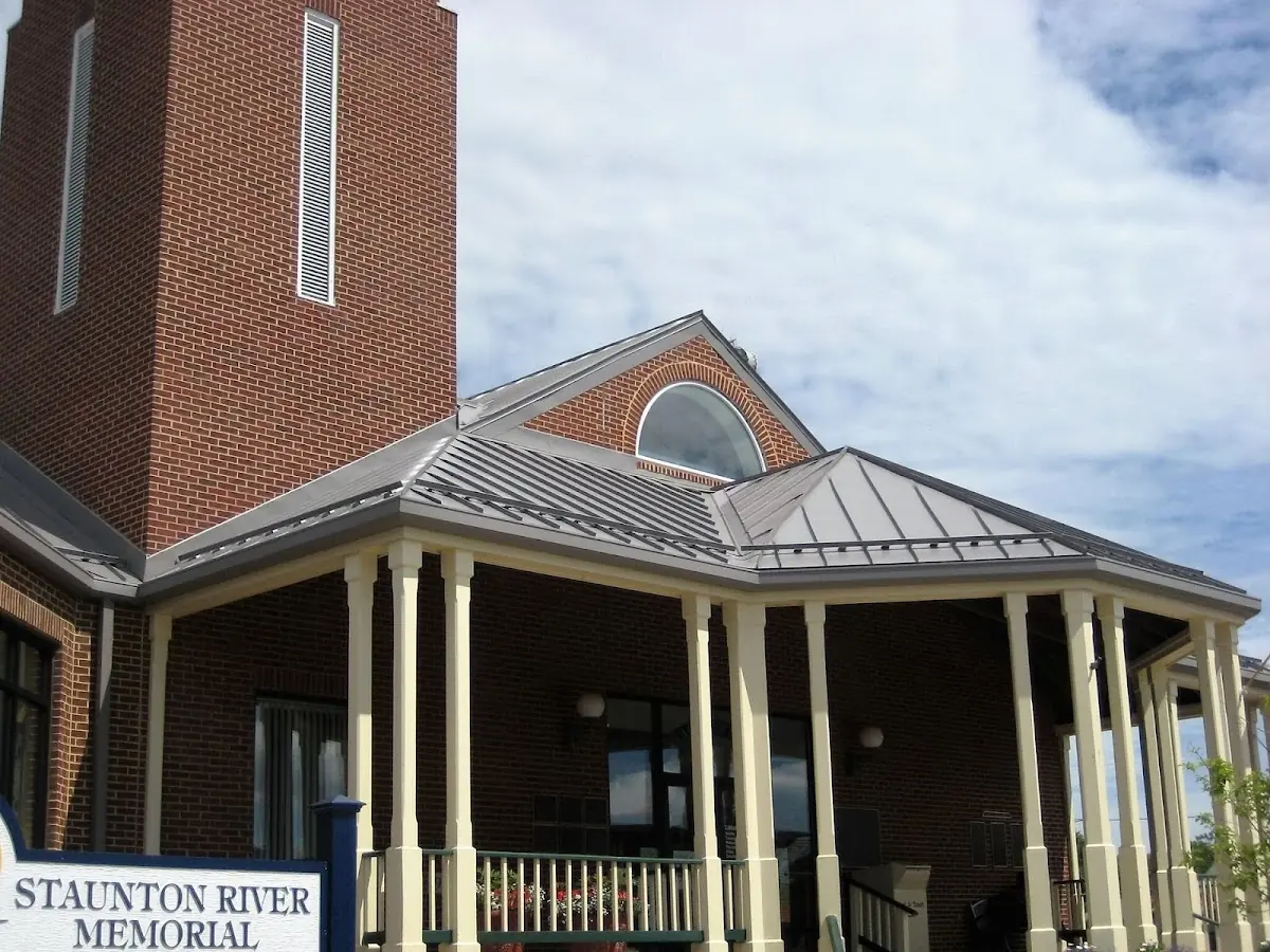 Skilled roofing craftsmen working on a residential roof in Macon